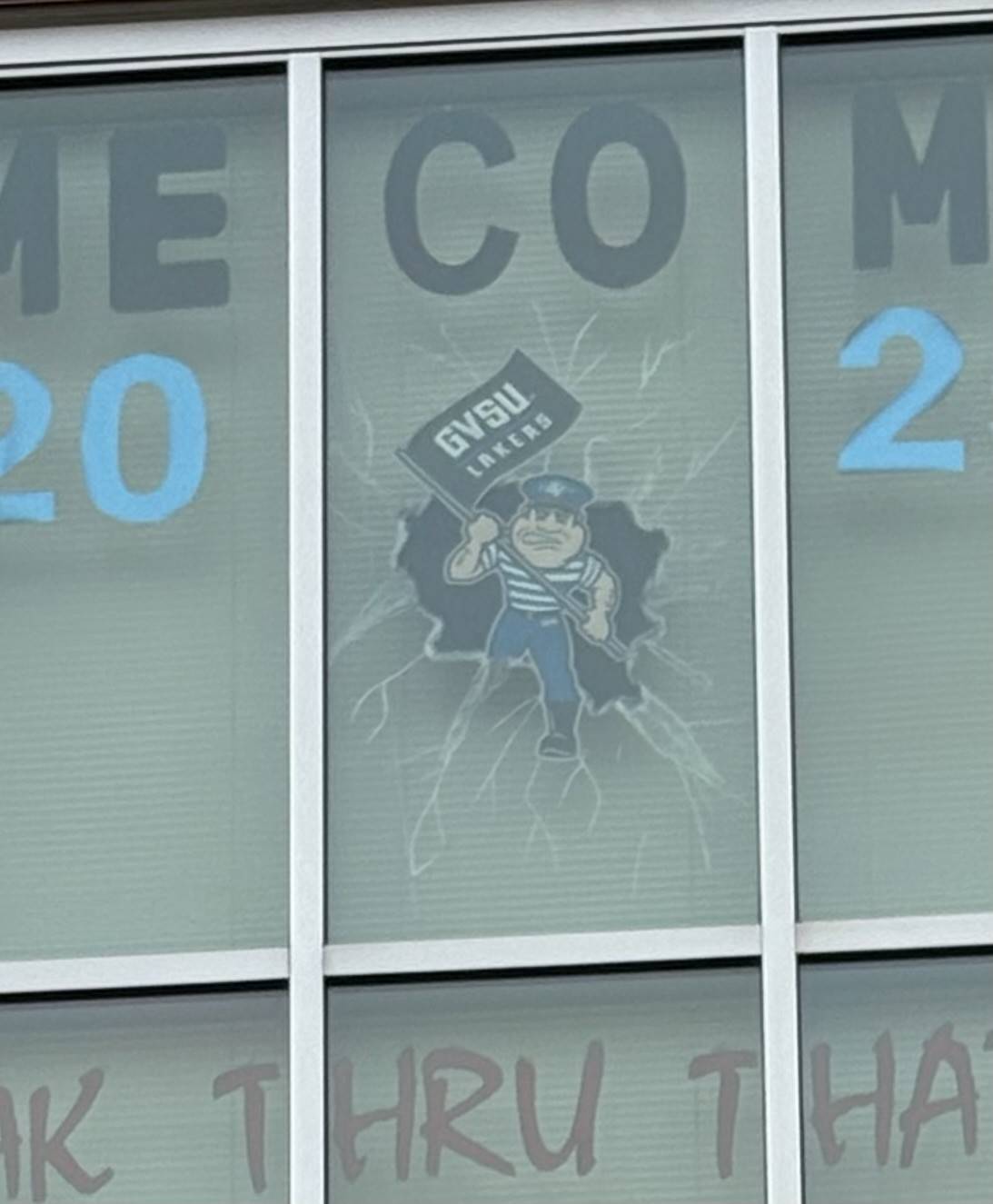 Louie breaking through the window